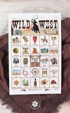 the wild west bingo game is shown on top of a brown scarf with an image of a cowboy