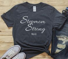 Step Mom Shirt, Bonus Mama Shirt, Gift For Step Mom, Stepmom shirt, Best Step Mom Ever, Mother's Day Gift, Cute Mom Shirt, Mom Birthday Gift Color is Gildan Dark Heather You've now found the staple t-shirt of your wardrobe. It's made of a thicker, heavier cotton, but it's still soft and comfy. And the double stitching on the neckline and sleeves add more durability to what is sure to be a favorite!   * 100% ring-spun cotton * Sport Grey is 90% ring-spun cotton, 10% polyester * Dark Heather is 65 Gift For Step Mom, Step Mom, Mama Shirts, Gift Cute, Mom Birthday, Step Moms, Mama Shirt, Mom Birthday Gift, Mom Shirt