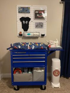 a blue rolling cart with various items on it