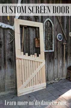 a wooden screen door sitting on top of a brick floor