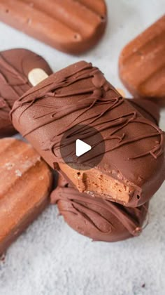 chocolate covered donuts on top of each other