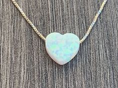 "Opal Heart Charm Necklace ** Please measure your neck before ordering (standard size is 16-18) ** 13\" & 14\" chains can not be returned Necklace Details: Sterling Silver 0.7mm Box Chain 14kt Gold Filled 0.7mm Box Chain Charm Details - Lab Created OPAL Opal Heart Charm - 10mm (Light Blue, Blue or White ) 100% satisfaction guaranteed . If for any reason you are not happy with this product you may ship it back. See other ideas: https://www.etsy.com/listing/652743766/opal-heartbeat-sterling-si White Heart Pendant Jewelry For Birthday Gift, White Heart Cut Jewelry For Anniversary Gift, White Heart Cut Jewelry For Anniversary, White Heart Cut Jewelry As Gift, White Heart Cut Jewelry For Gift, White Heart Cut Jewelry Gift, Great Graduation Gifts, Heart Charm Necklace, Silver Lights