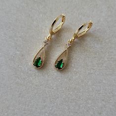 Emerald Green & Crystal Teardrop Teardrop Jewel Huggie Hoop Earrings,  Gold Plated Earrings, Vintage Style Earrings, Victorian Earrings  Product specifications: * Material: 14K Gold Plated Brass * Size Each charm measures 1.8 cm x 0.6 cm Packaging and Gifts: * All pieces of jewellery are sent in a mesh jewellery pouch with a thank you card.  Shipping: * All Australian orders will be shipped out within 1 - 3 days by standard untracked letter post. If you require tracking, please upgrade to that o Elegant Hypoallergenic May Birthstone Hoop Earrings, Emerald Green Crystal, Victorian Earrings, Jewellery Pouch, Vintage Style Earrings, Green Crystal, Huggie Hoop Earrings, Earrings Vintage, Style Earrings