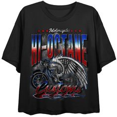 This women’s cropped tee is perfect for the wardrobe of a motorcycle fan! The black t-shirt has been custom-designed to feature a big, bold graphic of a motorcycle wrapped in eagle wings alongside the words “American Classic”—an eye-catching image that is sure to catch the attention of other fans! Since the tee is crafted from 100% high-quality cotton, it’s comfortable, durable, and suitable for all-day wear. To keep your cropped tee looking its best, simply machine wash it in cold water with li Black Biker T-shirt With Graphic Print, Black Graphic T-shirt For Motorcycling, Black Graphic Print T-shirt For Motorcycling, Black Graphic Tee For Motorcycling, Black Moto T-shirt With Graphic Print, Biker Black T-shirt With Graphic Print, Black Graphic T-shirt For Biker Events, Black T-shirt With Front Print For Biker Events, Black Graphic Print T-shirt For Biker Events