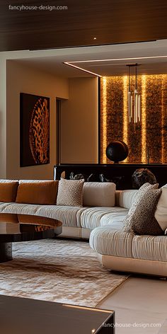 a living room filled with lots of furniture next to a wall covered in art work