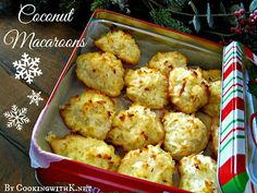 a box filled with muffins next to a christmas tree