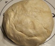 a ball of dough sitting on top of a wire rack