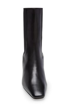 An elongated shaft with stretchy elastic panels accentuates the modern look of a sleek ankle boot featuring a low heel and Totême's signature square toe. 2 1/4" (60mm) heel Pull-on style Leather and textile upper/leather lining and sole Made in Italy SPACE: A shop for emerging and advanced designers Modern Chelsea Boots With Stacked Heel For Formal Occasions, Fitted Formal Chelsea Boots With Square Toe, Formal Fitted Chelsea Boots With Square Toe, Elegant Chelsea Boots With Square Toe In Calf Leather, Elegant Square Toe Chelsea Boots For Workwear, Elegant Square Toe Chelsea Boots For Work, Modern Chelsea Boots With Sculpted Heel For Work, Elegant Fitted Chelsea Boots With Square Toe, Fitted Square Toe Chelsea Boots For Work