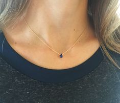 "This genuine teardrop sapphire sits on a simple, dainty chain. This minimalist necklace is perfect as an everyday necklace and it's also a great piece for layering necklaces. Blue sapphire is the September birthstone. Because of the simplicity and birthstone quality, this simple, dainty necklace makes the perfect birthday gift.  Model is wearing a 16\" sapphire teardrop necklace in gold filled, September's birthstone. CRAFTSMANSHIP  Jewelry is handmade by us in our NYC studio. We focus on craftsmanship and quality using only the highest quality materials and handpicked genuine gemstones.  PACKAGING We take pride in creating beautifully packaged orders. Jewelry arrives delicately wrapped in tissue and placed in a kraft box inside a logo drawstring pouch. Your package will arrive nice enoug Sapphire Necklace Gold, September Birthstone Necklace, Blue Sapphire Necklace, Everyday Necklace, Teardrop Necklace, September Birthstone, Sapphire Necklace, Sapphire Jewelry, Aquamarine Blue