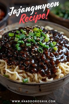 a bowl filled with noodles and sauce on top of a wooden table