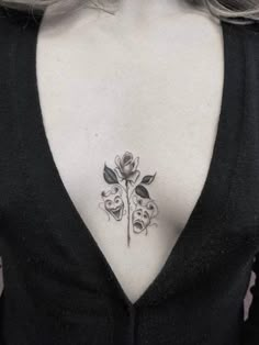 a woman with a rose tattoo on her back