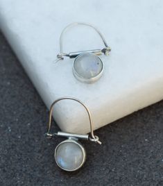 International deliveries in 2-4 business days as standard shipping. Totally handmade from 925 solid sterling silver. Unique hand made pair of earrings made with moonstones and sterling silver!! Great for every day or any occasion. Very comfortable to wear, lightweight with Interesting ear wire. The Genuine Moonstone is 10 mm in width and the total length is 25 mm. It comes gift wrapped and ready for giving! ✿REGISTERED MAIL WITH TRACKING NUMBER ✿All of our jewelry are made to order. Allow for ab Minimalist Nickel Free Moonstone Earrings, Minimalist Nickel-free Moonstone Earrings, Minimalist Silver Moon Phase Earrings, Silver Nickel-free Moonstone Earrings, Dainty Silver Moonstone Earrings, Moonstone Moon Charm Drop Earrings, Silver Moon Phase Earrings In Sterling Silver, Sterling Silver Teardrop Earrings With Moon Charm, Silver Teardrop Earrings With Moon Charm