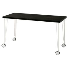 a black table with white legs and wheels on the bottom, in front of a white background