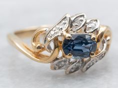 This retro style ring boasts a stunning oval cut blue sapphire, complimented by sparkling diamond accents. With its whimsical design, this ring adds a touch of vintage charm to any outfit. Perfect for the modern woman who appreciates classic elegance. Metal: 14K Yellow GoldGem: Sapphire .75 CaratsGem Measurements: 6.2 x 4.3 mm, OvalAccents: 8 Diamonds totaling .04 Carats, I1 in Clarity, H in ColorRing Size: 5.75Marks: “14K PUN” Stamped on the inside band Right Hand Ring, Diamond Accent Ring, Ring Sapphire, Right Hand Rings, Hand Ring, Sparkling Diamond, Whimsical Design, Ring Oval, September Birthstone