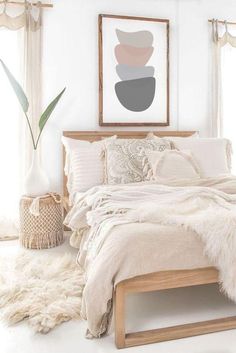 a bedroom with white walls and fur on the bed