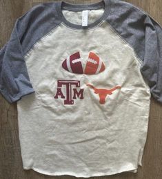 Check out our awesome collection of custom handmade House Divided sports team tees!  Support your favorite sports teams in style in one of our unique shirt designs. These shirts are perfect for the whole family, from infants to adults, and they're all about showing off your "House Divided" team spirit. Whether it's college teams or professional baseball, football, or soccer, we've got you covered! Each shirt is carefully made with fabric appliques sewn on, creating a one-of-a-kind design that st Varsity Cotton T-shirt With Custom Print, Sporty Tops With Custom Print For Fans, Game Day Fan Apparel Top With Heat Transfer Vinyl, Sports Fan Cotton T-shirt With Custom Print, Red Custom Print T-shirt For Game Day, Custom Print Cotton T-shirt For Sports Fans, Collegiate White T-shirt With Heat Transfer Vinyl, White Collegiate T-shirt With Heat Transfer Vinyl, Cotton Tops With Heat Transfer Vinyl For Football Season