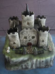 a castle made out of clay sitting on top of a table