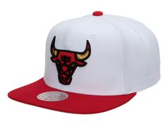 the chicago bulls snap back hat is white and red with a bull head embroidered on it