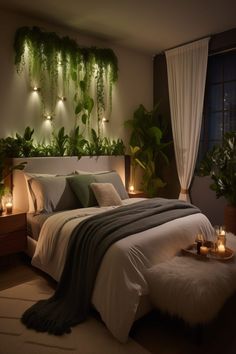 a bedroom with plants and candles on the wall