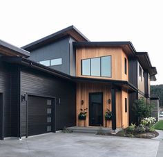 a large house with two garages in front of it and the words price landing written on