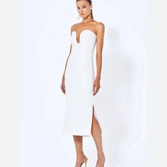 White Strapless Dress. New With Tags. Boning And Corset Inside. White Strapless Midi Dress For Evening, White Midi Dress With Fitted Bodice For Night Out, White Strapless Knee-length Evening Dress, White Strapless Midi Dress For Formal Occasions, White Strapless Midi Dress For Cocktail, White Knee-length Strapless Dress For Date Night, White Knee-length Strapless Dress For Formal Occasions, White Knee-length Strapless Cocktail Dress, White Midi Dress With Sweetheart Neckline For Night Out