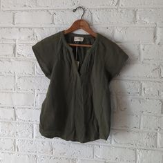 Gauzy Cotton Top In The Perfect Shade Of Green. Casual Green Split Neck Top, Casual V-neck Top For Spring Layering, Olive V-neck Tops For Spring, Casual Olive V-neck Top, Olive Tops For Summer Workwear, Short Sleeve V-neck Top For Spring Layering, Casual Cotton V-neck Top For Work, Casual V-neck Blouse For Layering, Casual Daywear Tops With Split Neck