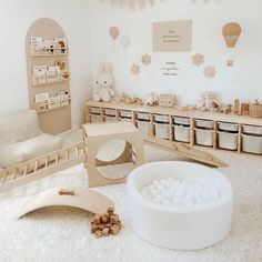 a room filled with lots of furniture and toys on top of a white carpeted floor