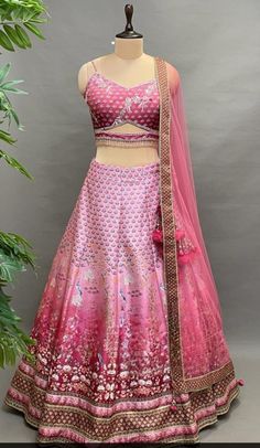 This Lehenga Choli is Ready to Wear A stunning lehenga with beautiful Embroidered Silk blouse, dupatta and lehenga, designed specially for wedding season. mesmerizing Pink Lehenga Set that captivates with its elegant print. The eye-catching lehenga is crafted in silk with stones work. It is paired with a Silk blouse having applique embroidery and a dupatta having Net & Beautiful Boder. Style it with statement jewellery and heels for a wedding or an engagement ceremony, showcasing style and sophi Semi-stitched Meenakari Lehenga For Wedding, Semi-stitched Anarkali Lehenga With Meenakari, Semi-stitched Lehenga With Meenakari For Navratri, Wedding Meenakari Dola Silk Lehenga, Semi-stitched Art Silk Lehenga With Meenakari Details, Unstitched Meenakari Lehenga For Eid, Fitted Pink Anarkali Set With Meenakari, Fitted Meenakari Lehenga For Eid, Fitted Meenakari Lehenga For Diwali