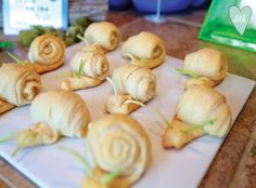 small rolls are arranged on a cutting board