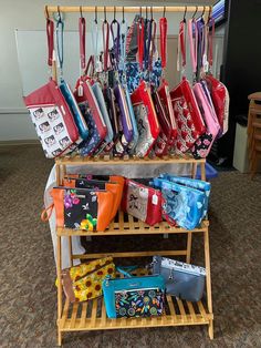 several purses and bags are on display in a room