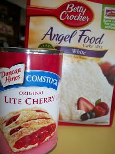 a can of ice cream next to a bag of angel food cake mix on a counter