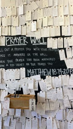 the wall is covered with hundreds of notes and messages from people who have passed their lives