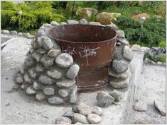 a bucket sitting on top of a pile of rocks