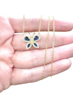 - 18K Gold plated sterling silver, small sapphire blue butterfly pendant encrusted with high shine cubic zirconia stones - Pendant dimensions:  (height 1/2") (width 5/8") - Dainty and shines brightly  - 18K Gold plated sterling silver chain, adjustable at 16" 17" and 18" Dainty Butterfly, Butterfly Blue, September Birthstone, Butterfly Necklace, Butterfly Pendant, Sapphire Blue, Necklace Sterling Silver, Blue Butterfly, Gold Plated Sterling Silver