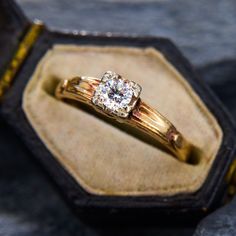 a close up of a ring in a box