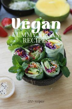 the cover of vegan yummy veggie can recipe is displayed on a wooden table