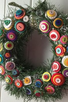 a wreath made out of buttons and needles