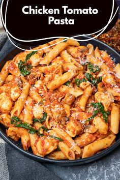 chicken tomato pasta in a skillet with parmesan cheese and spinach on top