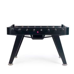 a black foosball table with pink buttons on it's sides and legs