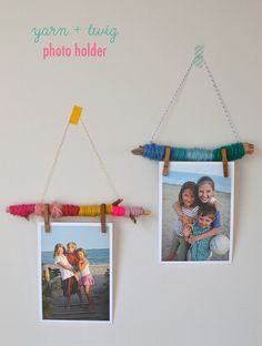 two pictures hanging on a wall with clothes pins attached to them