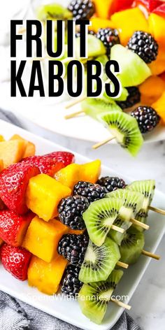 fruit kabobs on a white plate with the title above it