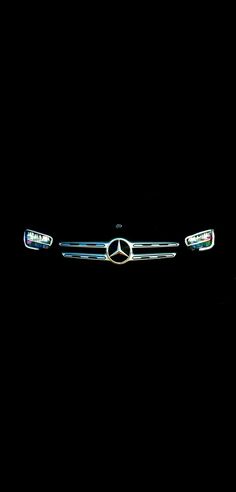 the front end of a car in the dark