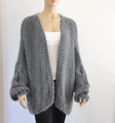 Cozy Gray Acrylic Outerwear, Gray Soft Knit Acrylic Outerwear, Oversized Chunky Knit Sweater Coat In Acrylic, Oversized Chunky Knit Acrylic Sweater Coat, Oversized Acrylic Sweater Coat With Chunky Knit, Oversized Cozy Acrylic Cardigan, Cozy Oversized Acrylic Cardigan, Cozy Chunky Knit Acrylic Cardigan, Cold Weather Chunky Knit Acrylic Cardigan