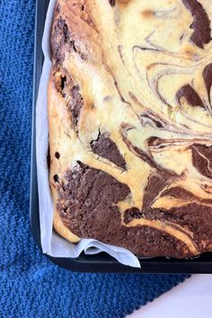 a loaf of chocolate swirled bread in a pan