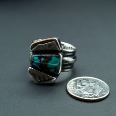 This piece features a piece of natural Turquoise balanced between two beautifully unique silver boxes. During your day, we envision this ring will remind you that balance leads to harmony, and your harmony is vital to your wellbeing. Perfect for any outfit, this ring wears well any day of the week. Natural Turquoise and .925/.999 silver. This ring is a size: 9(US) Setting size: 15X22mm (stone 14X8mm) Turquoise Healing Properties, Silver Tops, Silver Box, Day Of The Week, Natural Turquoise, Hand Engraving, Ring Box, Turquoise Ring, Statement Rings