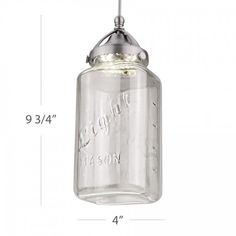 a glass jar hanging from a metal hook