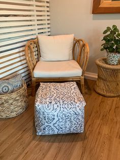 a chair and ottoman in a room with wood floors