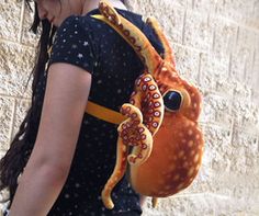 a woman carrying an octopus backpack on her back