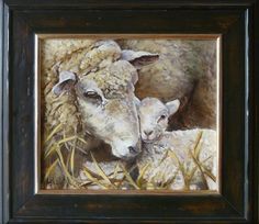 a painting of two lambs in a frame on the wall next to each other