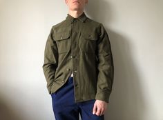 US Army Wool Shirt / OG107 / Vietnam War Era / Army Wool Shirt / OG-107 / Deadstock / Size S This vintage military shirt in wonderful new deadstock condition - made in USA - ERA 1970's - color - green - 2 outside pockets - 6 buttons at front - 2 button on the cuffs - material - wool 80% , nylon 20% - label size - S (watch measurements) FLAT Measurements: Shoulders : 18 inches (46cm) Chest (underarm to underarm) : 22 inches (56cm) Sleeve : 24 inches (61cm) Length(back) : 29 1/2 inches (75cm) Pay Swedish Army, Workwear Overalls, Military Shirt, Military Outfit, Wool Shirt, Vintage Military, Dark Blue Color, Us Army, Work Pants